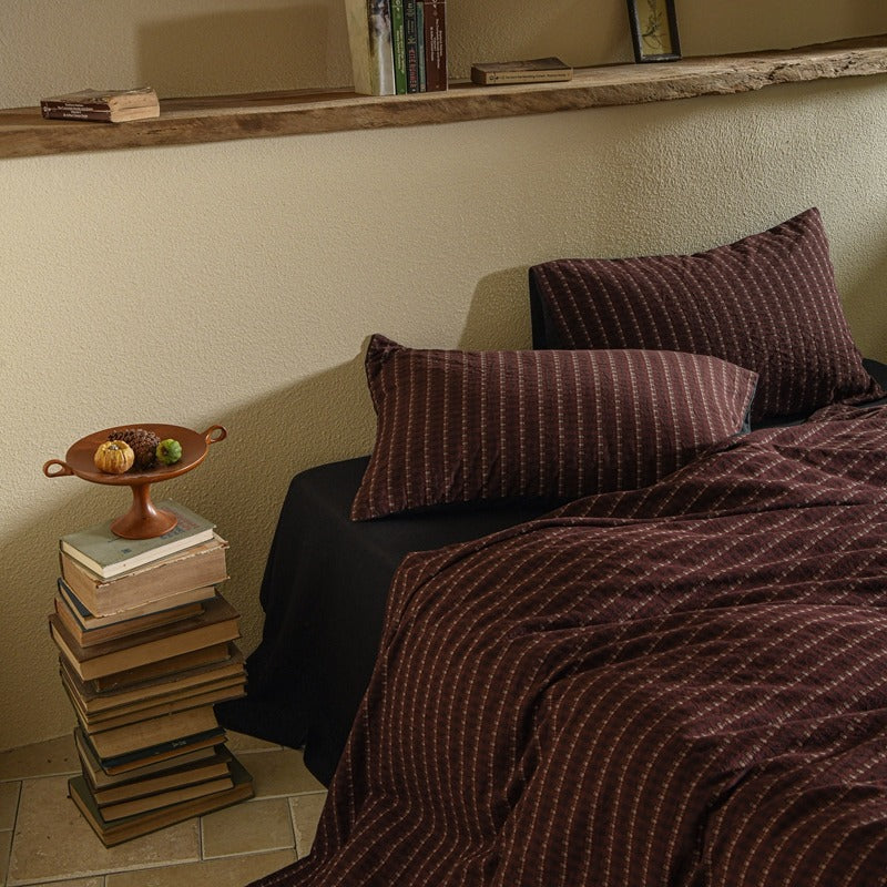 Amberlyn Burgundy Motif Stripe cotton bedding set – closer view of the coordinated pillows and duvet - Roomden