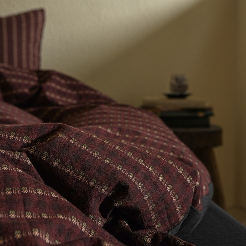 Amberlyn Burgundy Motif Stripe cotton bedding set – close view of the small pattern and fabric folds - Roomden