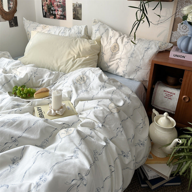 Ivory Blue Ribbon Floral Cotton Bedding Set – full bed scene with coordinating pillow styling - Roomden