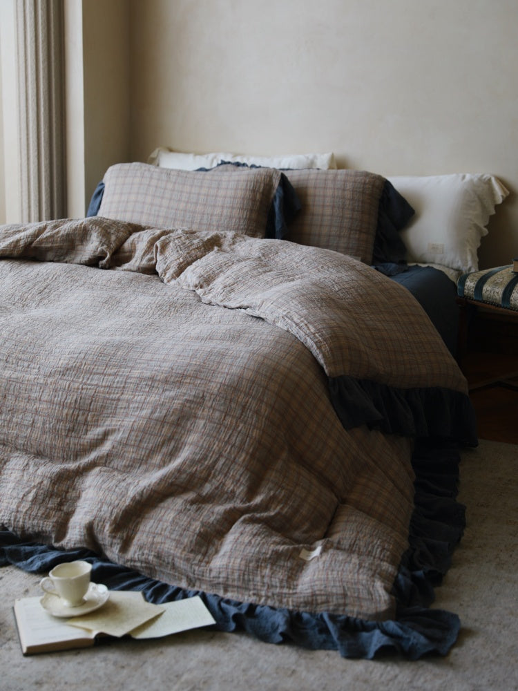 Contrast Ruffle Checked Cotton Gauze Bedding Set – slate checked duvet folded across the bed - Roomden