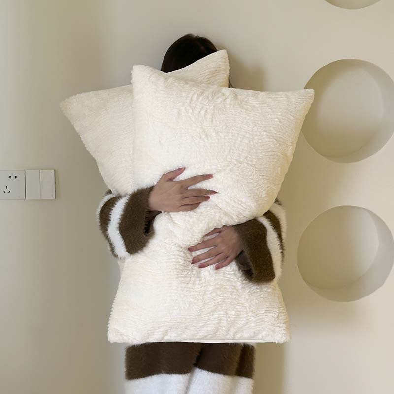 Wave textured plush bedding – creamy white model holding the textured pillows - Roomden