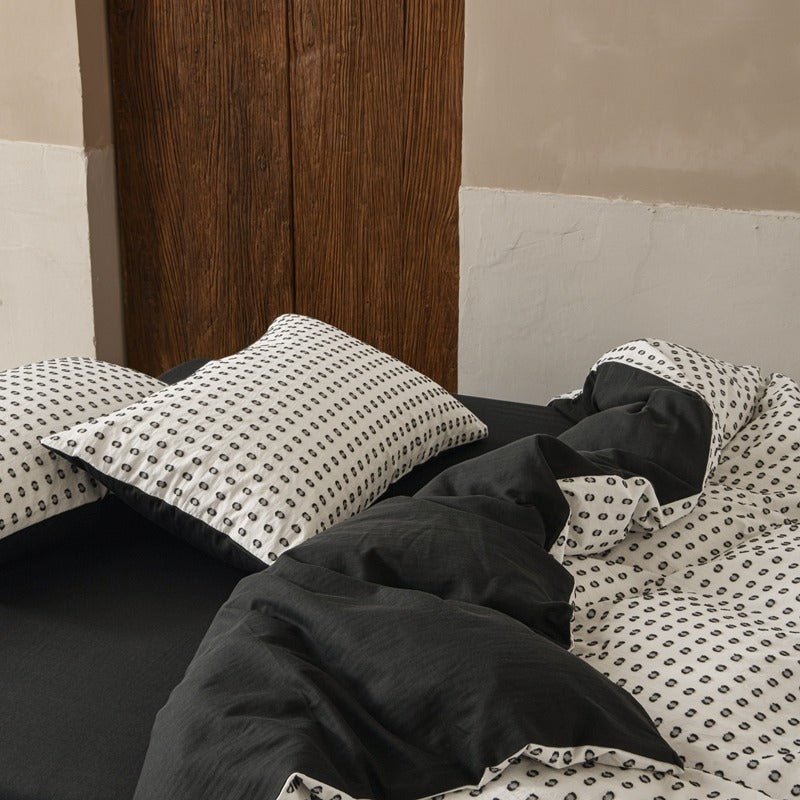 Amberlyn White Dotted cotton bedding set – closer view of the coordinated pillows and duvet - Roomden