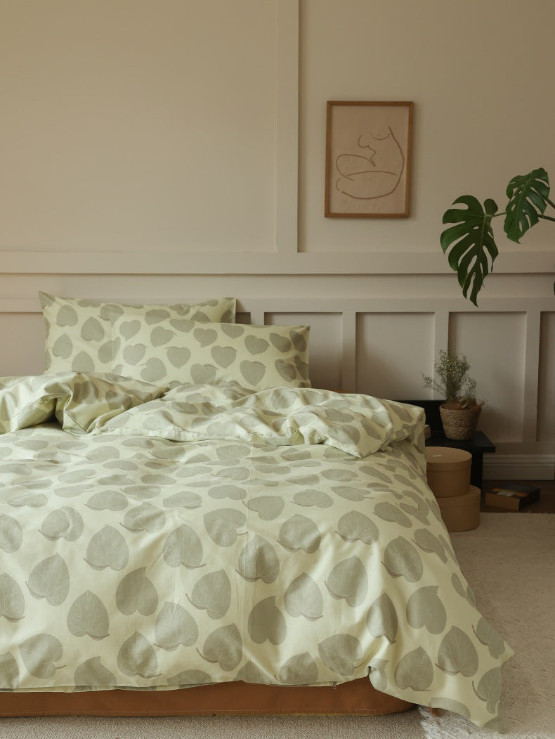 Sage Heart Leaf Cotton Bedding Set – front view of softly folded leaf-print bedding - Roomden