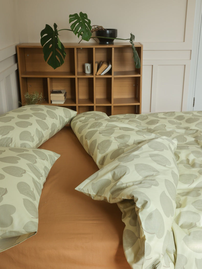 Sage Heart Leaf Cotton Bedding Set – overhead pillow arrangement showing a warm plain sheet - Roomden