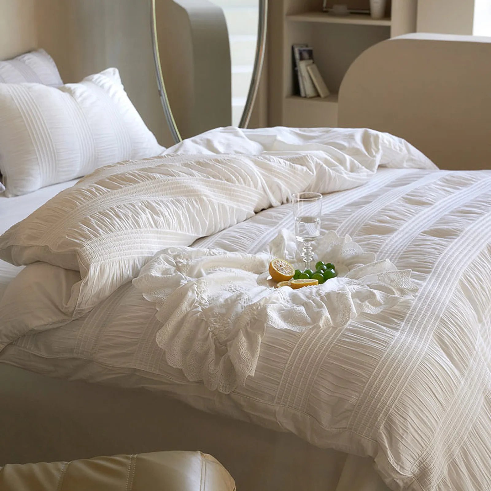Classic White pintuck bedding with a tray of fruit, highlighting its fresh and clean aesthetic.