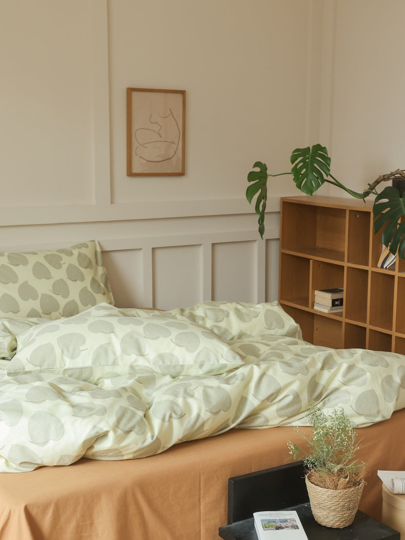 Sage Heart Leaf Cotton Bedding Set – wide side view showing the bed and wooden furniture - Roomden