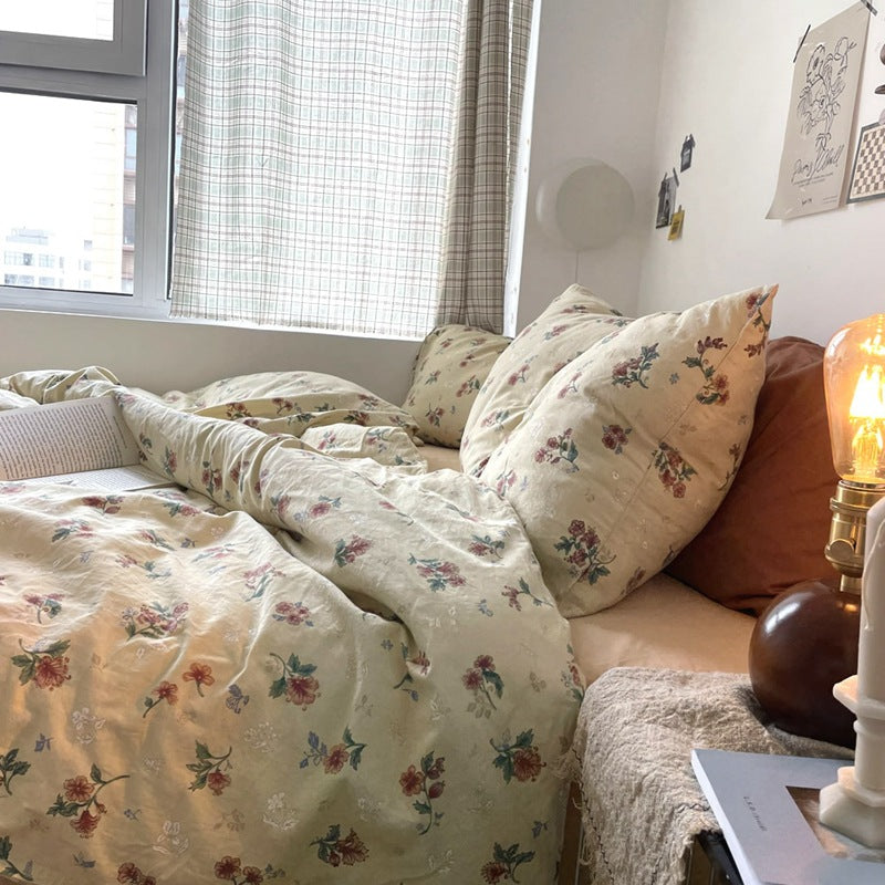 Florhaven Vintage Rose cotton bedding set – angled view of the rose-print duvet and pillows - Roomden