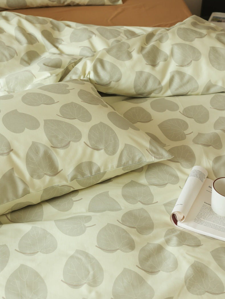Sage Heart Leaf Cotton Bedding Set – leaf-vein pattern detail beside a cup - Roomden