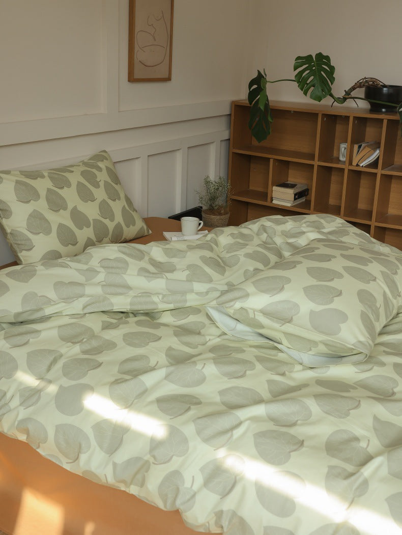 Sage Heart Leaf Cotton Bedding Set – sunlit side view of the leaf-print duvet - Roomden