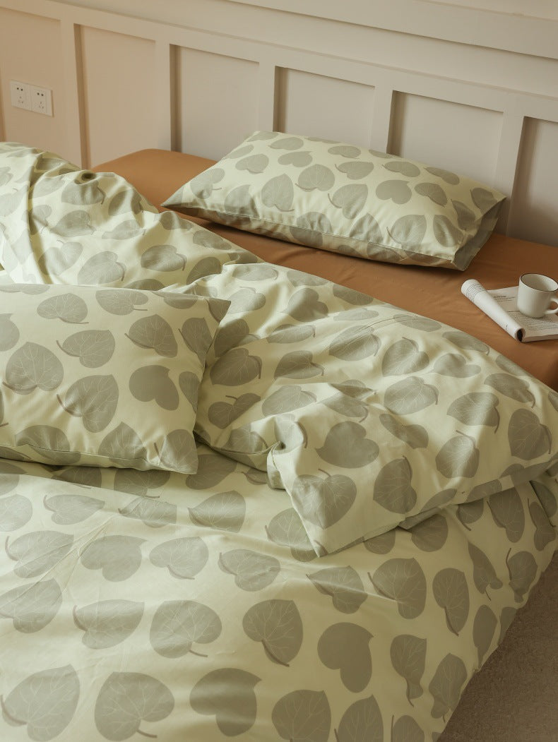 Sage Heart Leaf Cotton Bedding Set – close view of rounded leaves across duvet folds - Roomden