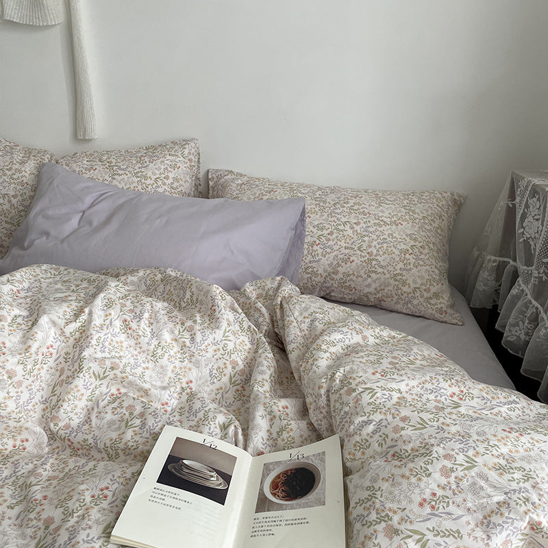 Ivory miniature meadow cotton bedding – front view of the small floral print and mixed pillow styling - Roomden