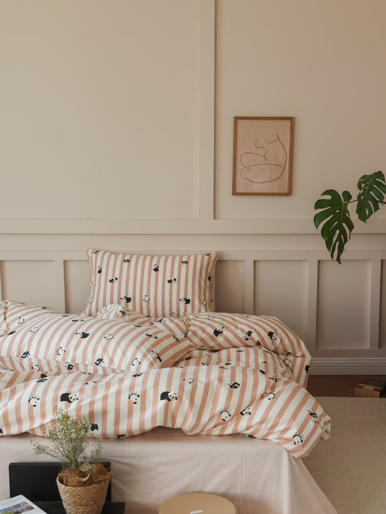 Peach Panda Stripe Cotton Bedding Set – wide bedroom view with a low table - Roomden