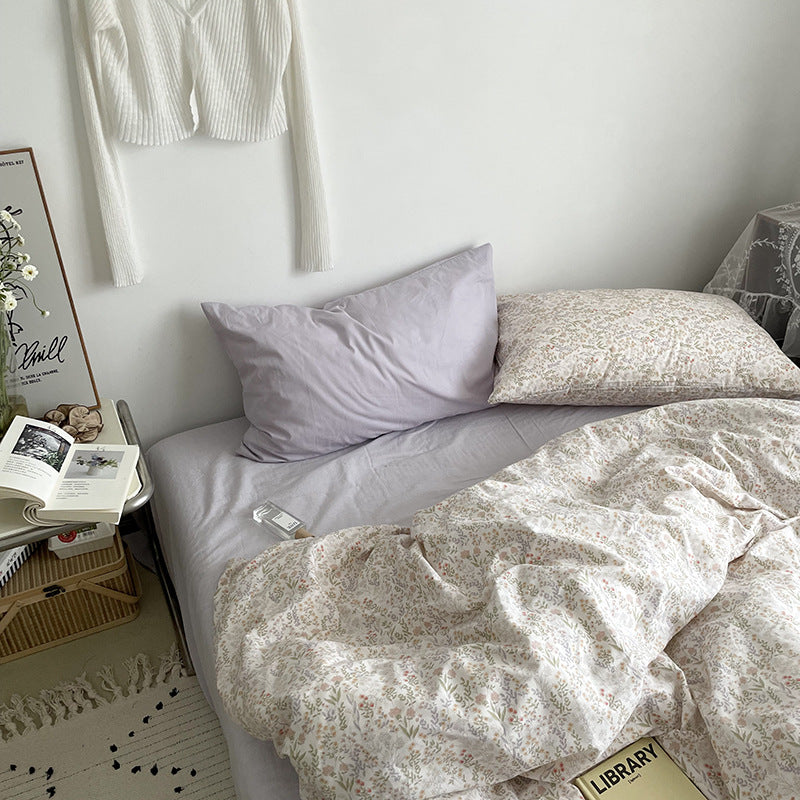 Ivory miniature meadow cotton bedding – full bed scene with floral cover and lilac pillow styling - Roomden