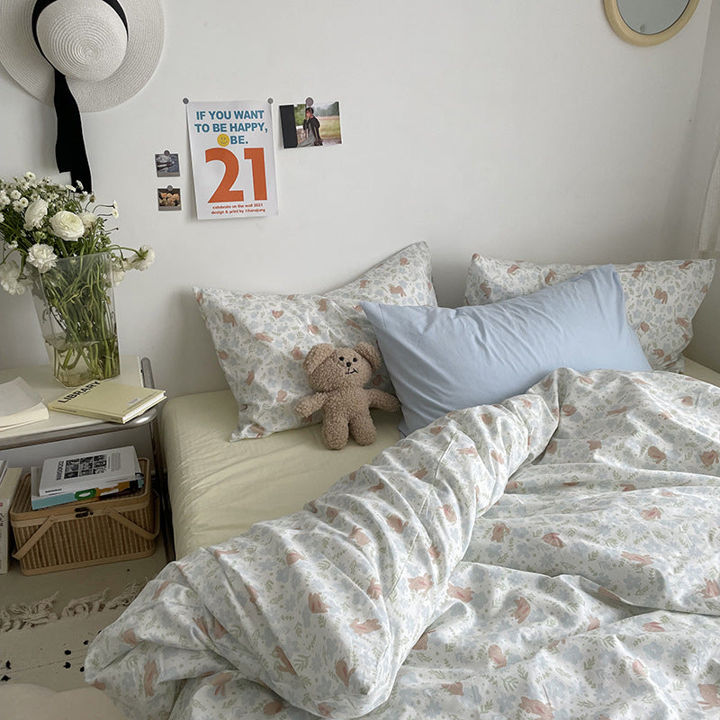Pastel woodland cotton bedding – side view of the pastel woodland duvet in a furnished bedroom - Roomden