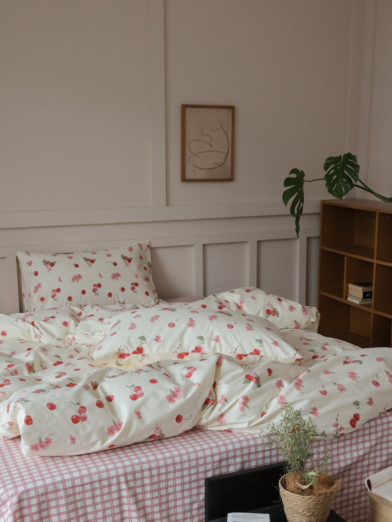 Ivory Cherry Floral Cotton Bedding Set – wide side view beside a wooden bookcase - Roomden