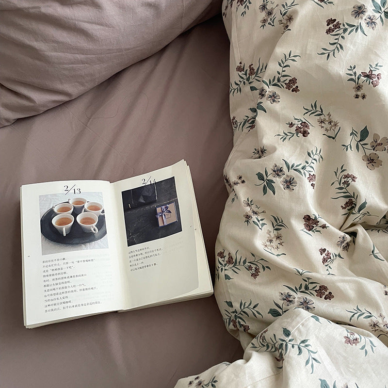 Florhaven Ink Sprig cotton bedding set – detail of the dark sprigs beside the plain taupe sheet - Roomden