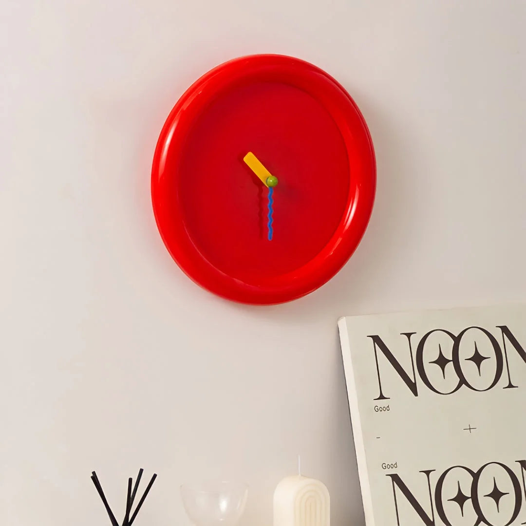 Angled view of the Cherry Red Chunky Frame Wall Clock on a white wall - RoomDen