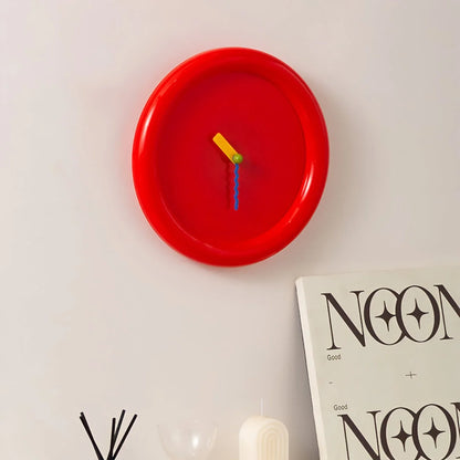 Angled view of the Cherry Red Chunky Frame Wall Clock on a white wall - RoomDen