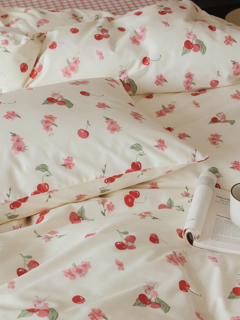 Ivory Cherry Floral Cotton Bedding Set – fabric detail of red cherries and green leaves - Roomden