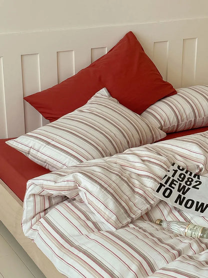 Close-up of the Red Striped variant of the Textured Pinstripe Washed Cotton Bedding Set. - RoomDen