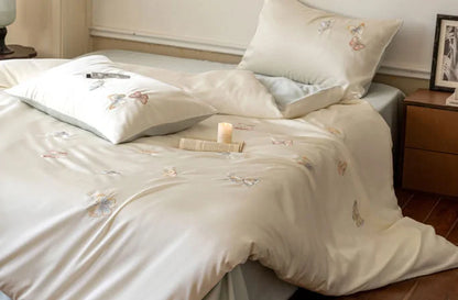 A fully styled bed showcasing the elegant and romantic look of the Tencel bedding set.