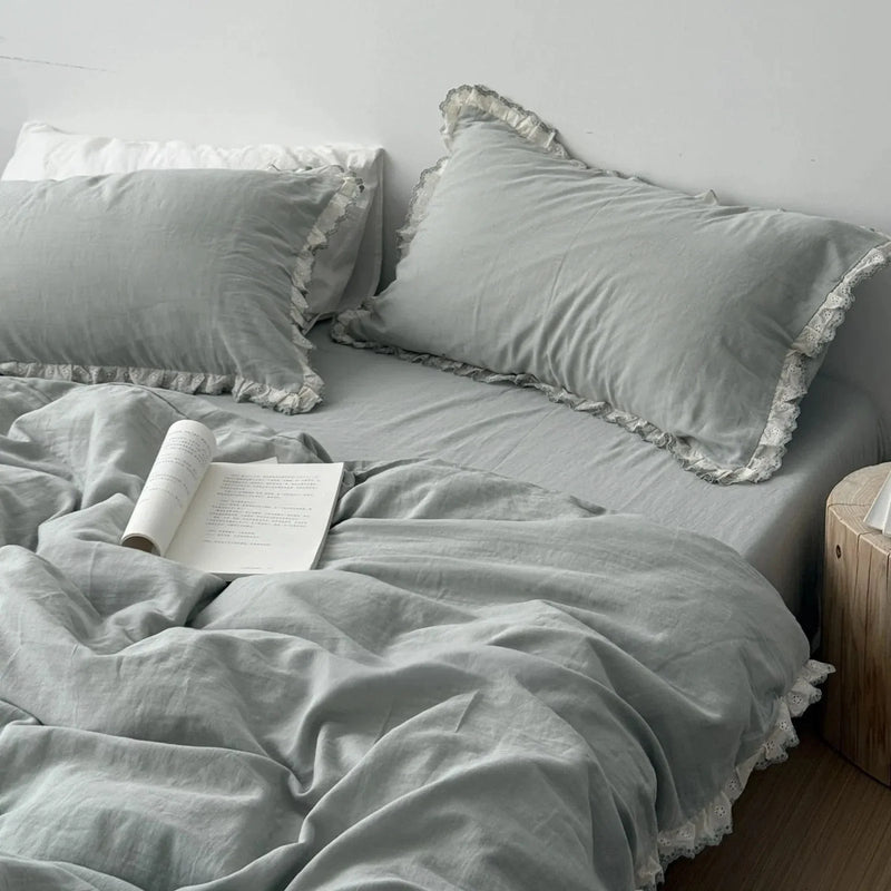 Full view of the Soft Embroidered Lace Ruffle Cotton Bedding Set in a calming sage green — RoomDen