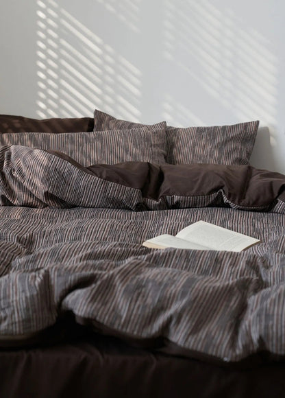 Mocha Brown Pinstripe Washed Cotton Bedding Set with sunlight casting shadows from blinds - RoomDen