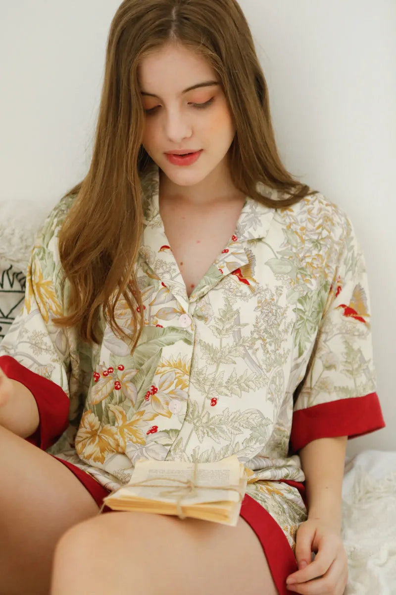 RoomDen Silky Festive Berry Botanical Cotton Sateen Pajama Set - Close Up Reading Book - Cozy Atmosphere