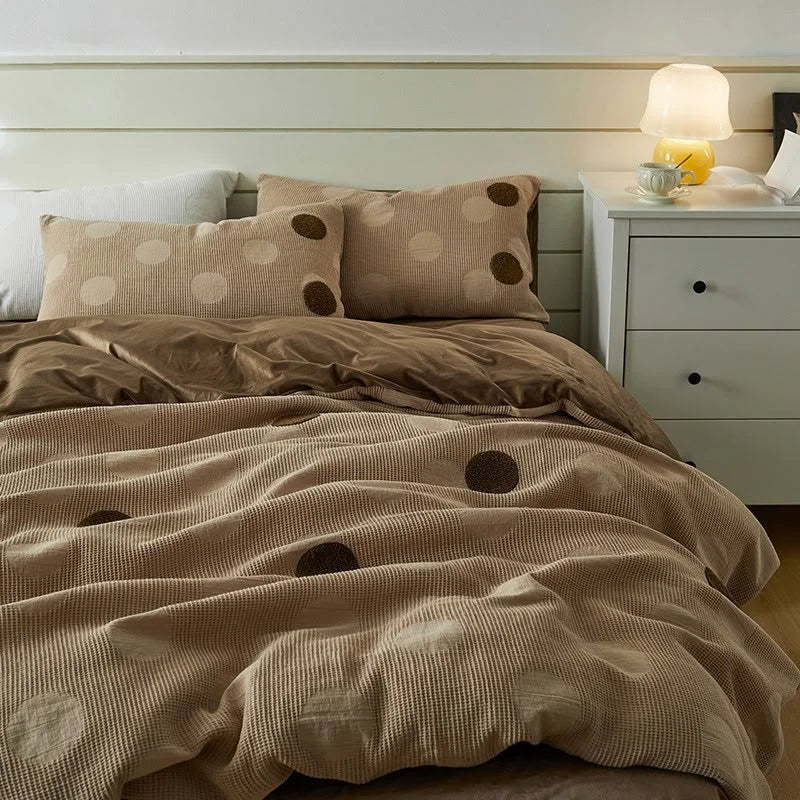 Lifestyle image of the Mocha Polka Dot Flannel Fleece Bedding Set on a bed with a white shiplap headboard. - RoomDen