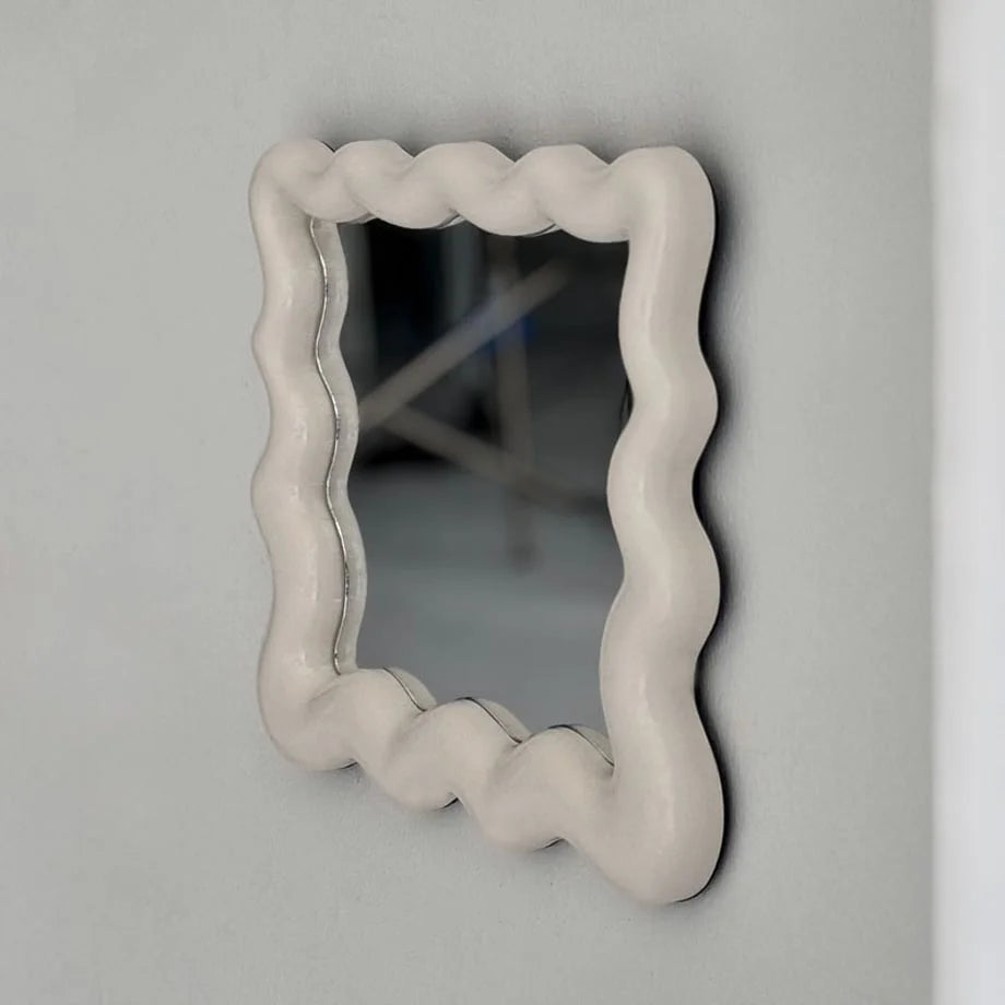 Close-up angled view of the off-white wavy frame, showing its texture and curves - RoomDen