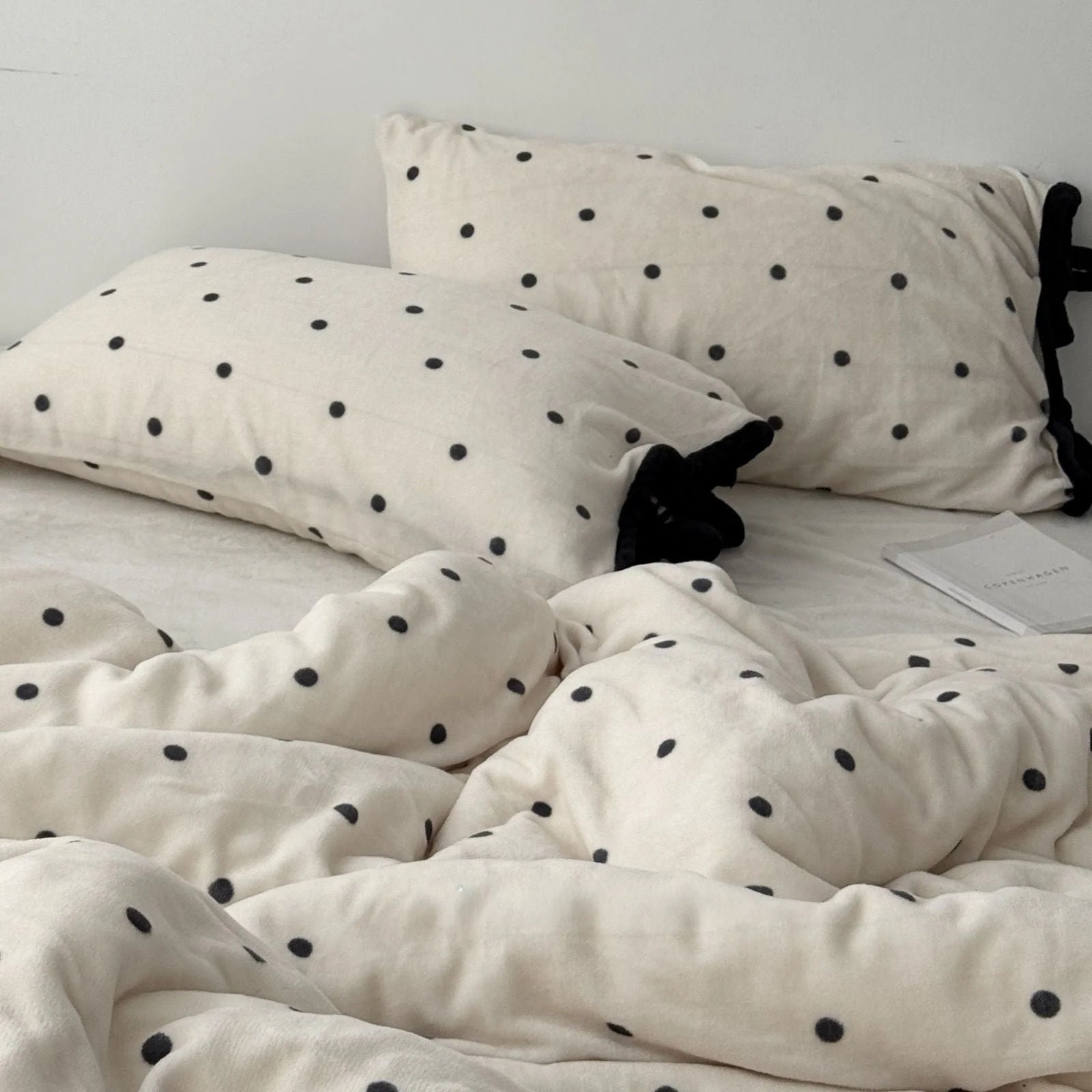 Another view of the Creamy White Polka Dot Flannel Fleece Bedding set, looking cozy and inviting.