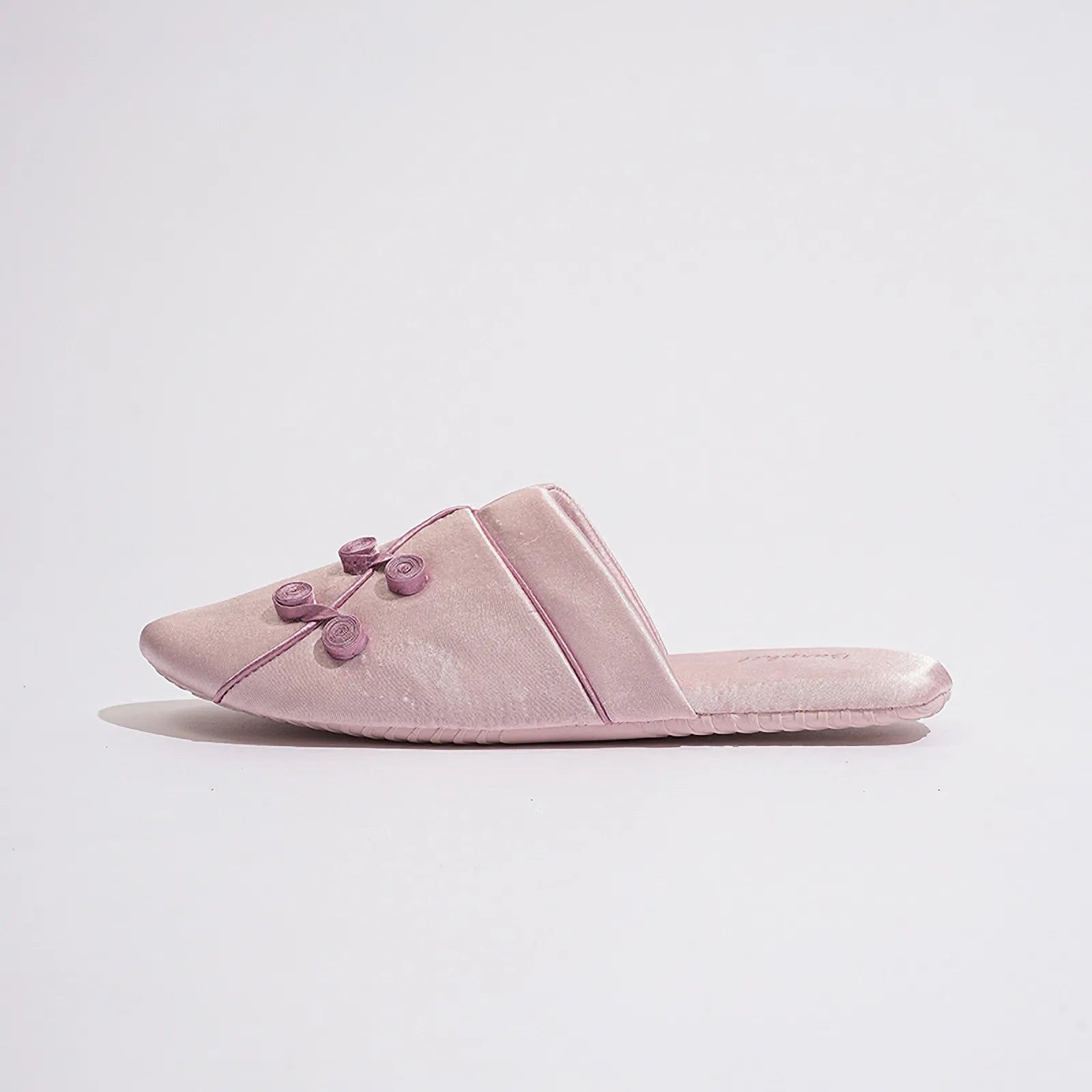 Side profile of Serenity Blue slippers highlighting the knot buttons - RoomDen