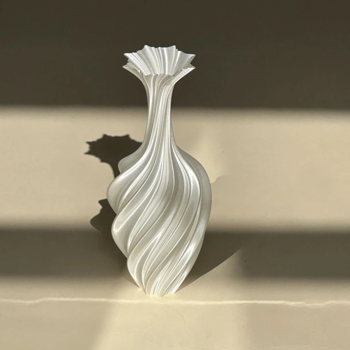 Sculptural Swirl Ribbed PLA Vase in Pearl White with dramatic shadows - RoomDen