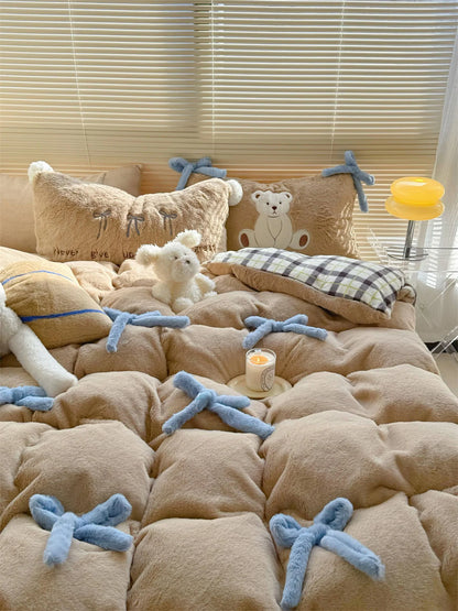 Lifestyle shot of the Khaki Brown Bear bedding with a plush white toy and candle.