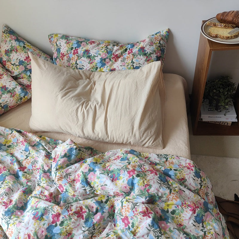 Multicolor Garden Bloom Cotton Bedding Set – front view of floral and cream pillow styling - Roomden