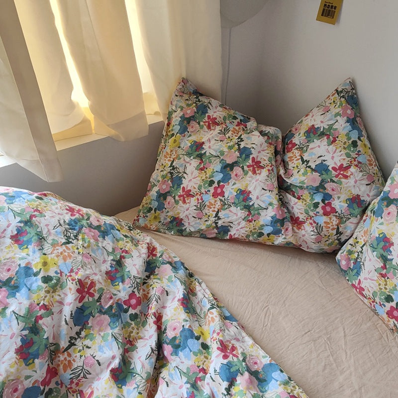 Multicolor Garden Bloom Cotton Bedding Set – close view of the floral print and cream sheet - Roomden