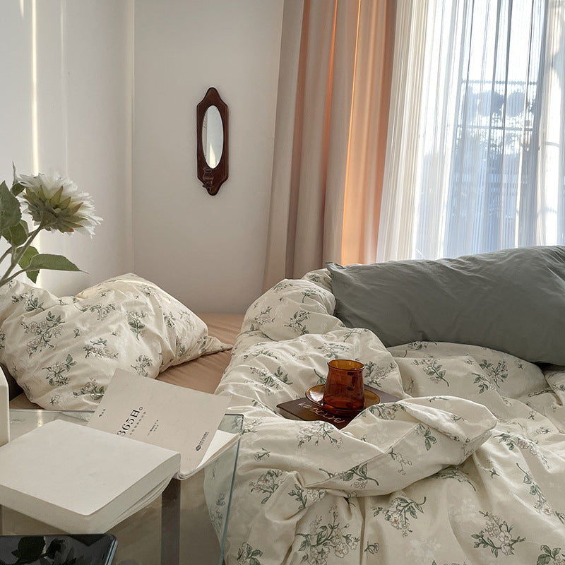 Florhaven Gardenia Sprig cotton bedding set – side view of the botanical duvet beside the window - Roomden