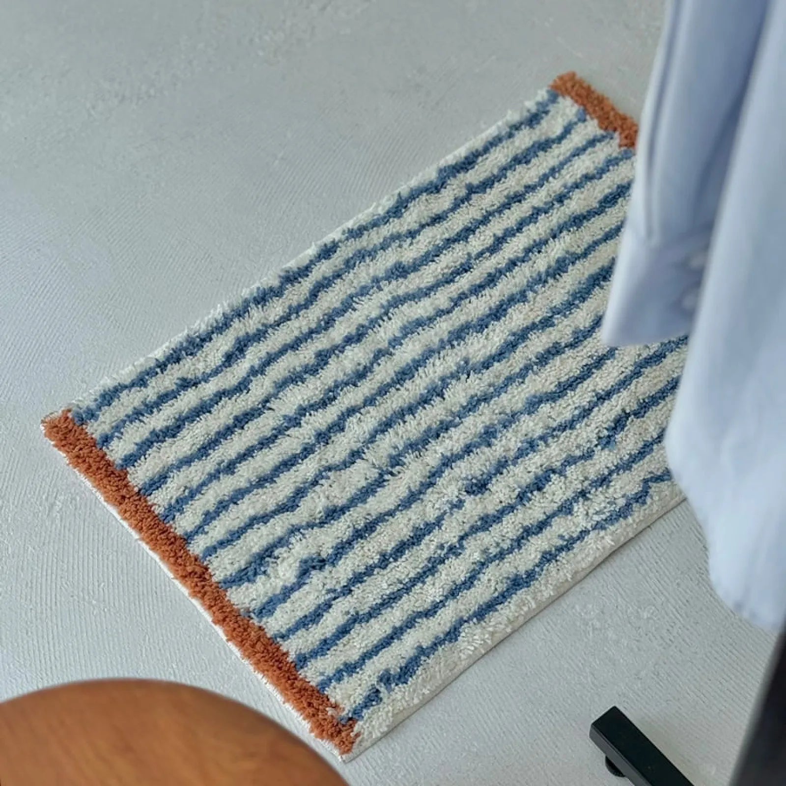 Top down view of Brown & Blue Striped wavy rug highlighting the pattern