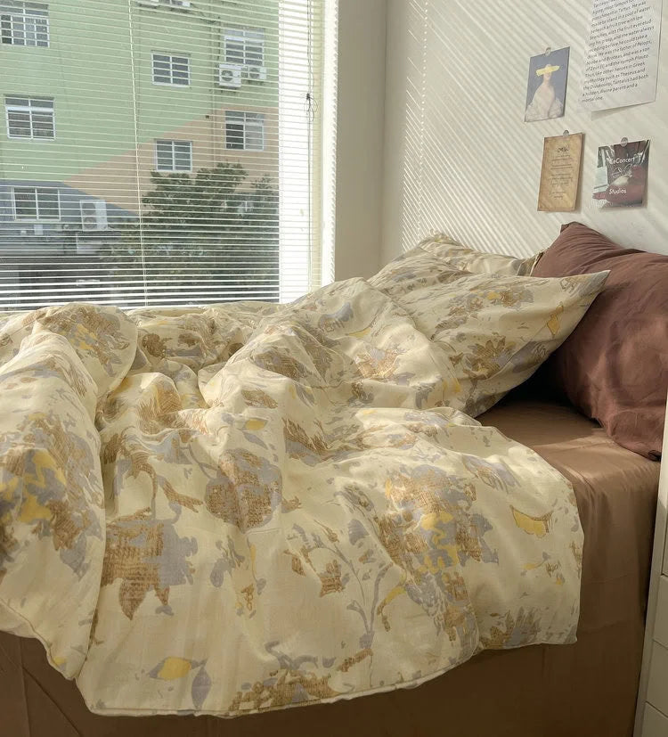 The vintage floral bedding set illuminated by sunlight streaming through window blinds, showcasing its soft, crinkled texture. - RoomDen