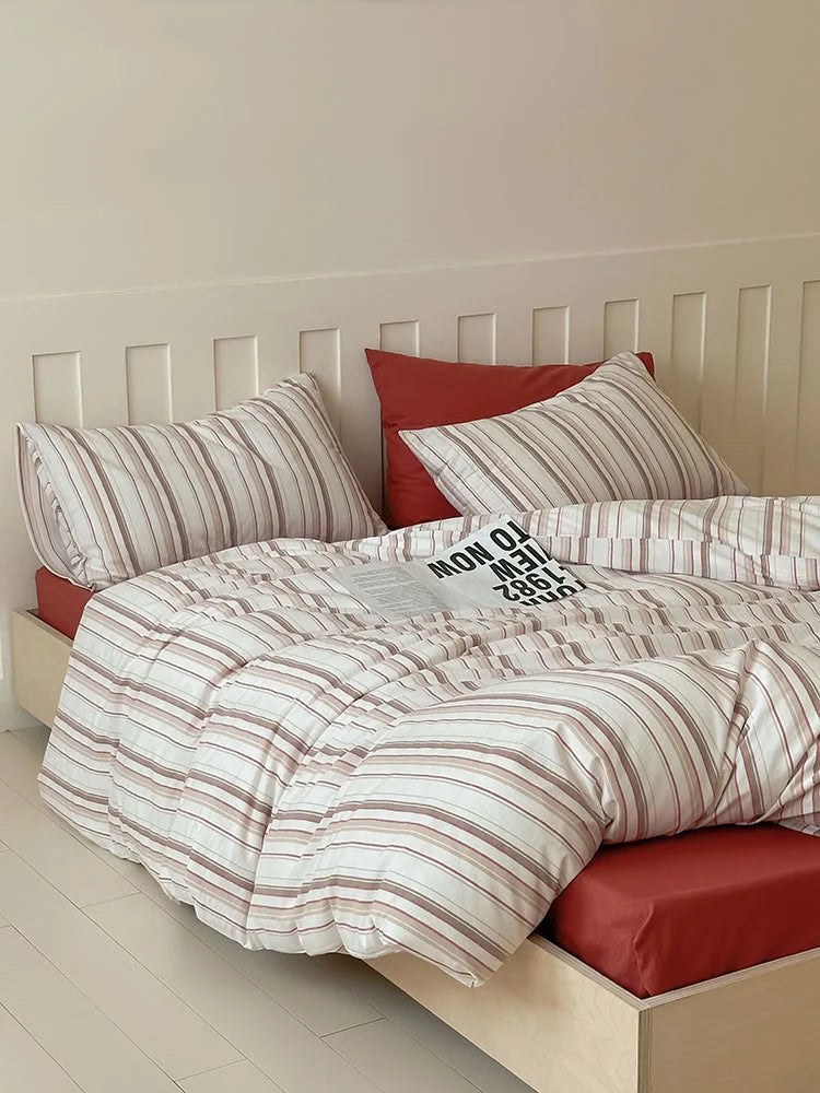 Another view of the Red Pinstripe Washed Cotton Bedding Set, styled for a cozy bedroom. - RoomDen