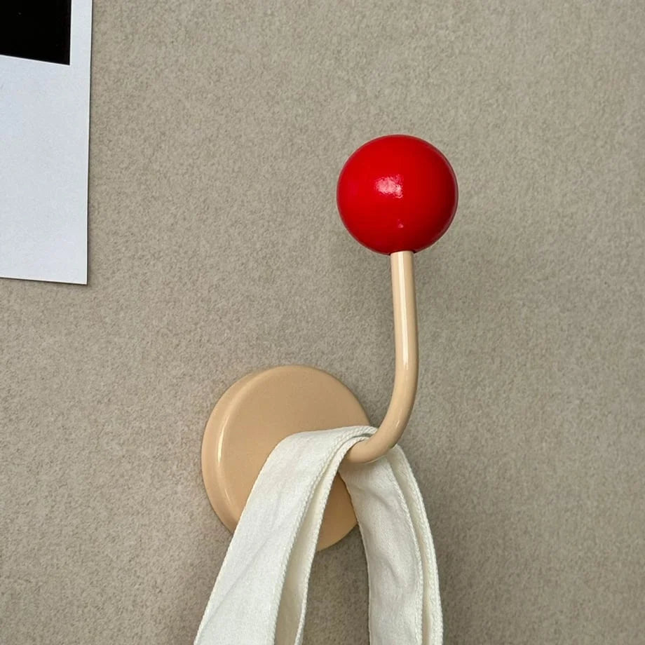 Red & Beige Color Block Metal Hook holding a white canvas tote bag against a textured wall - RoomDen.