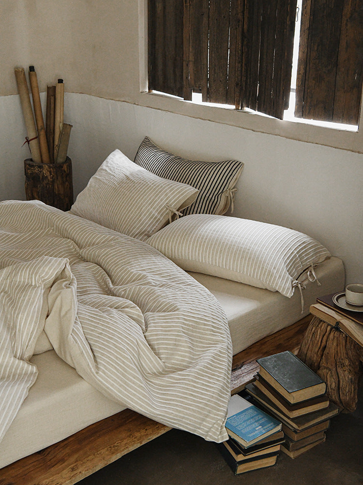 Ashfield Ivory Pinstripe Bedding Set – Angled view of narrow striped pillows and duvet - Roomden