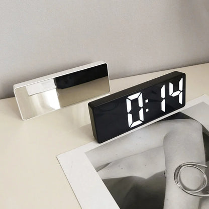 Side-by-side view of the black and white variants of the Mirrored Acrylic Digital Clock on a desk. - RoomDen
