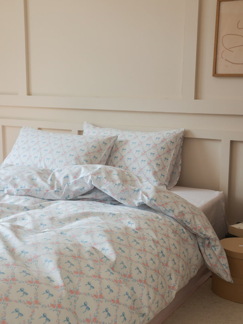 Ivory Blue Bow Rose Cotton Bedding Set – relaxed duvet folds and a single upright pillow - Roomden