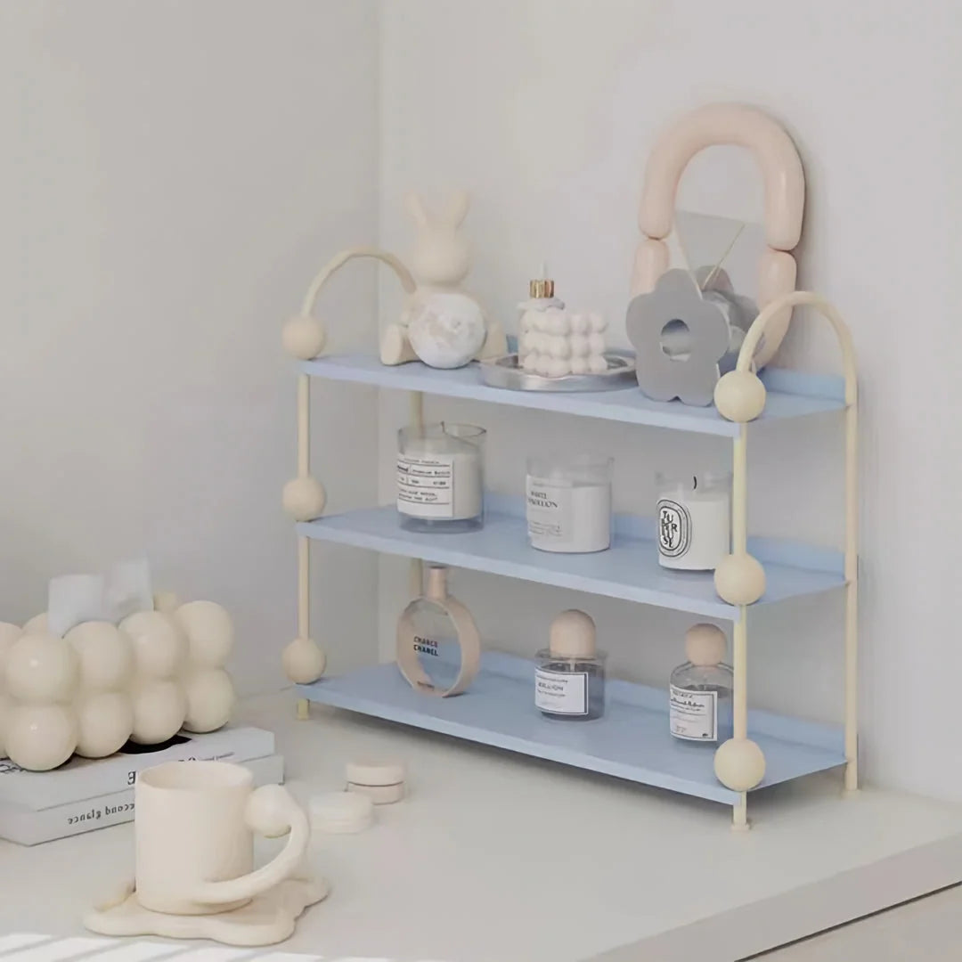 Lifestyle shot of the Sky Blue & Cream organizer, showing its use for candles, perfumes, and trinkets - RoomDen.