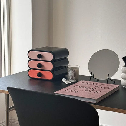Angled view of the three-tier wavy makeup organizer in a bright, modern room setting. - RoomDen