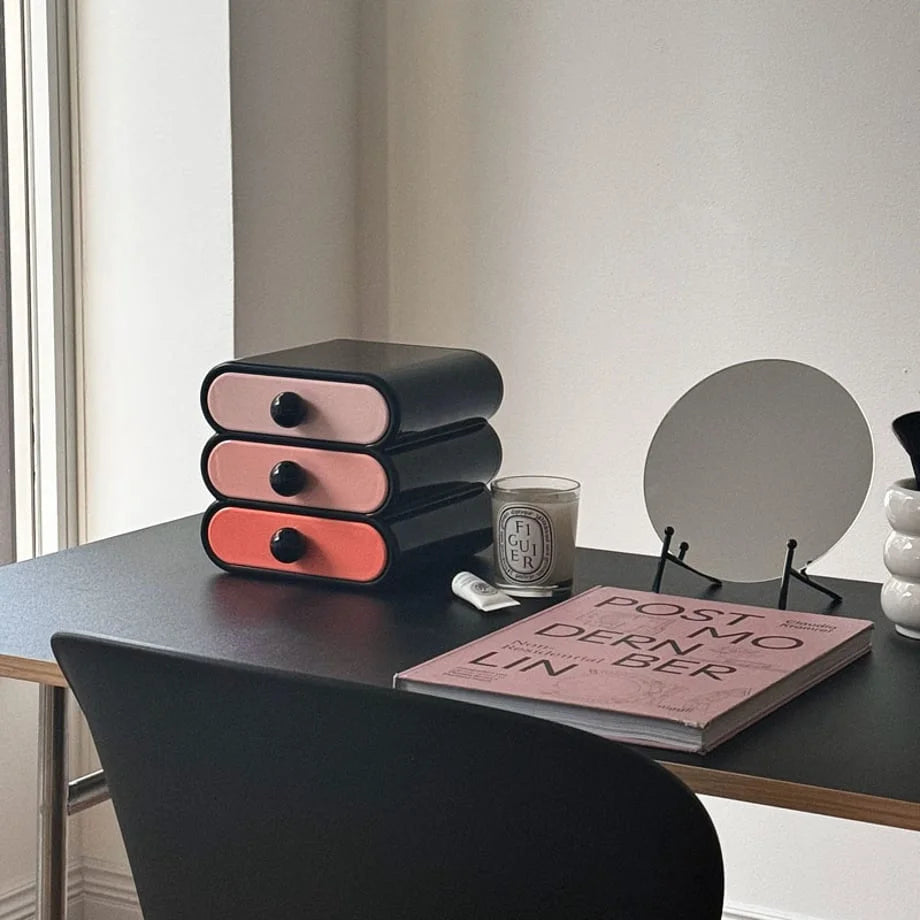 Angled view of the three-tier wavy makeup organizer in a bright, modern room setting. - RoomDen