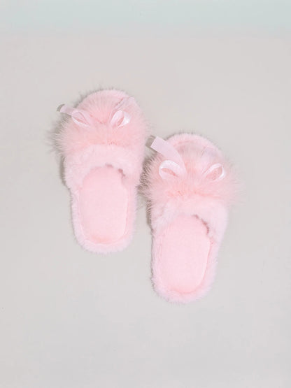 Pair of Baby Pink soft faux fur slides isolated on grey background