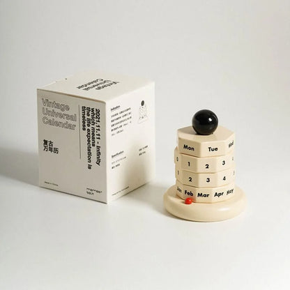 The "Vintage Universal Calendar" box and the wooden calendar set against a plain background. - RoomDen