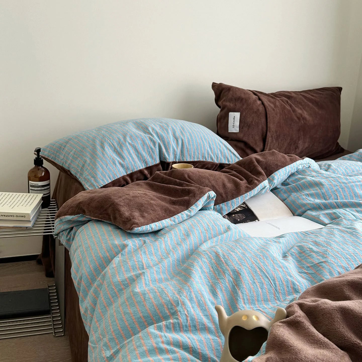 Plush Reversible Striped Flannel Fleece Bedding Set in Brown & Blue in a modern bedroom setting - RoomDen
